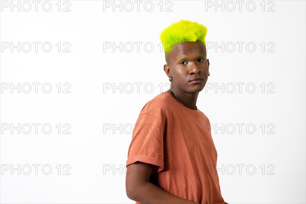 A gay black ethnicity man in studio with white background