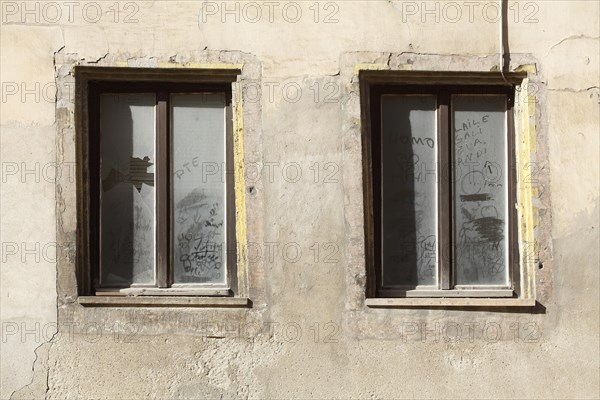 Old windows on an old dilapidated house