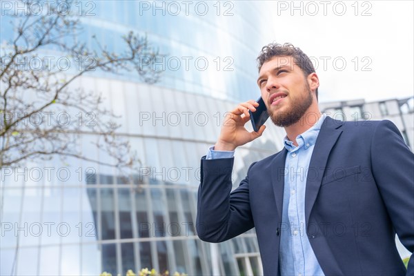 Businessman or finance man on a work call outside the office