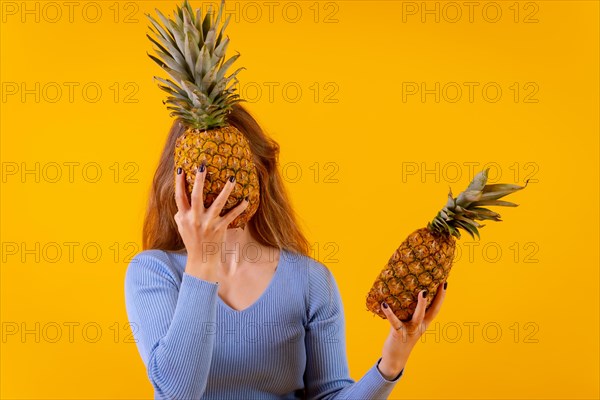 Woman with a pineapple in sunglasses