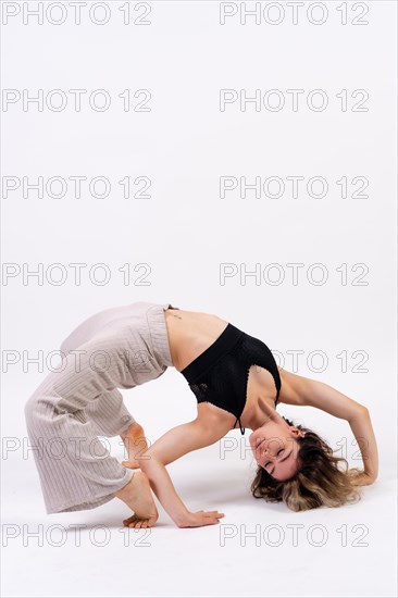 Young dancer in studio photo session with a white background