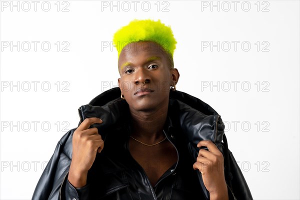 Black ethnic man in studio with white background