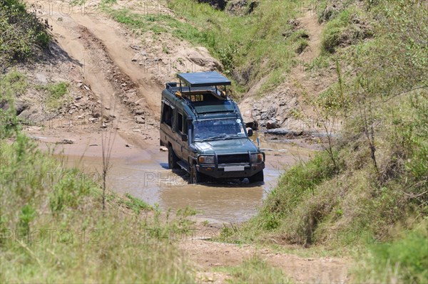 Safari car at river crossing