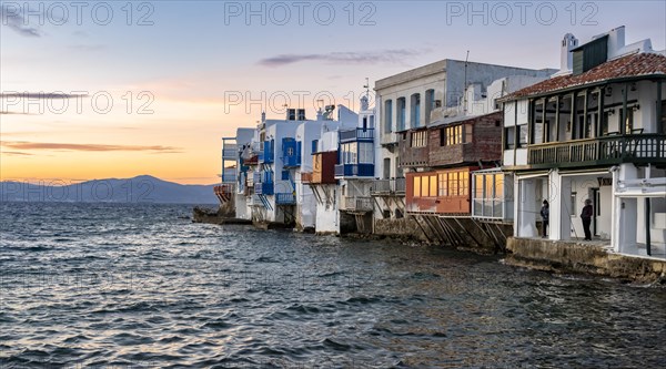 White Cycladic houses on the shore