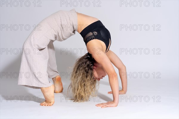 Young dancer in studio photo session with a white background