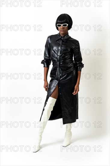 Black ethnic man in studio with white background