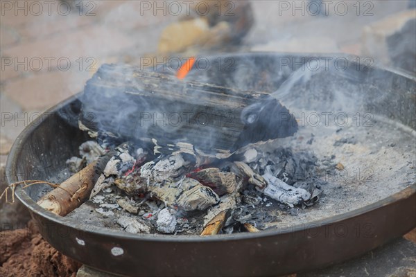 Fire bowl with burning wood