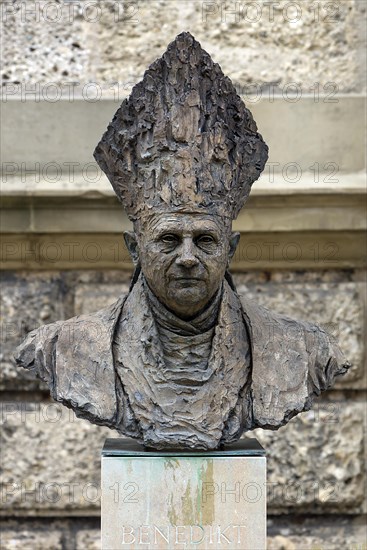 Bust of the German Pope Benedict XVI in front of the parish church Sankt Oswald