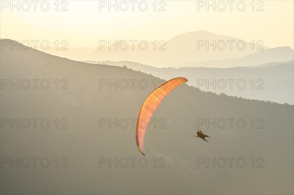 Paragliding flight in the air over the mountains. Drome