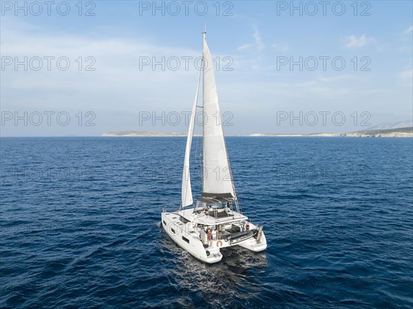 Sailing catamaran in full sail