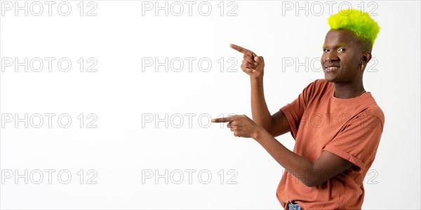 A gay black man in studio against a white background