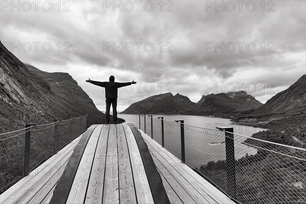 Tourist standing on observation platform Bergsbotn