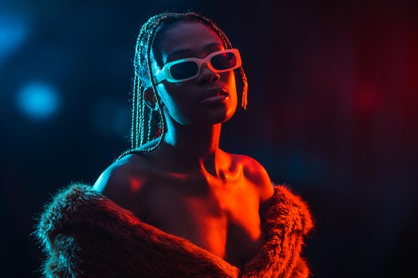 Black ethnic woman with braids with blue and red led lights