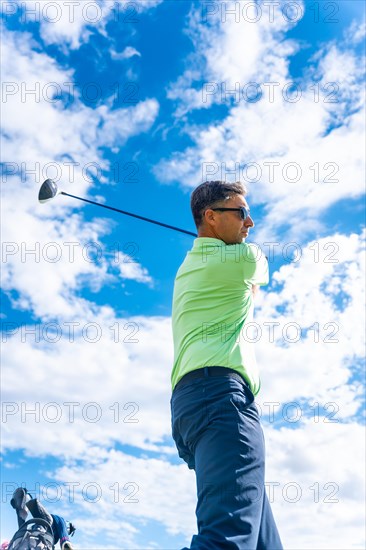 Detail of a golf player on the golf course