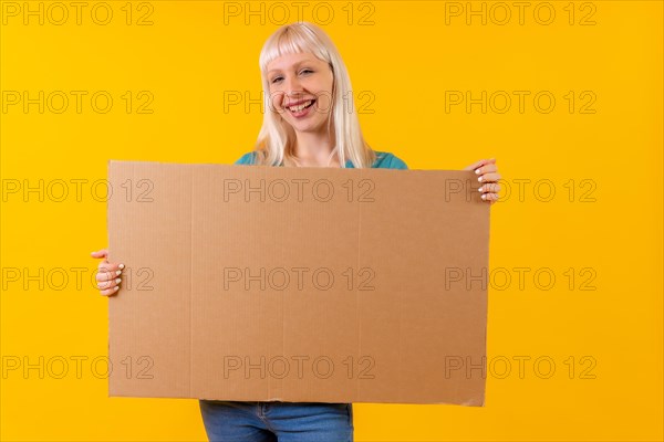 Holding empty cardboard advertisement poster