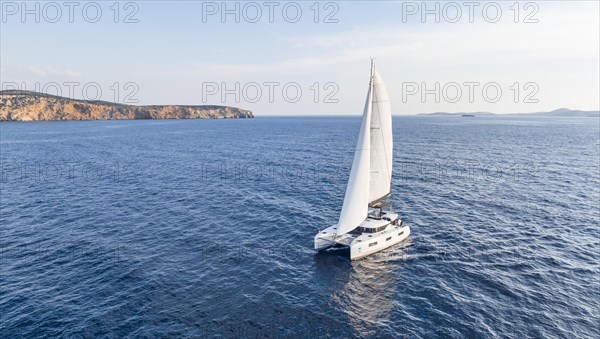 Sailing catamaran in full sail