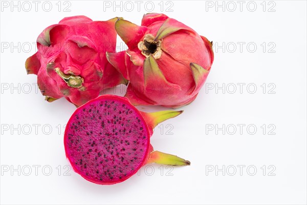 Pink pitahaya or dragon fruit isolated on white background with copy-space