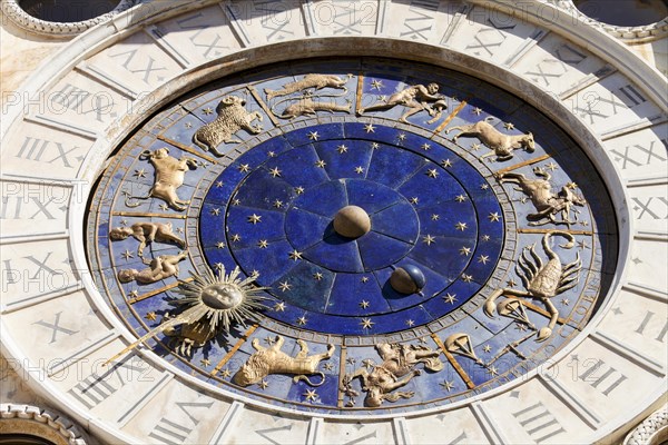The astrological clock with moon phases and zodiac signs and dial made of Lapis Lazuli