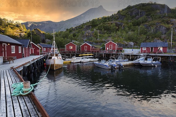 Red fishing huts and boats in the open-air museum