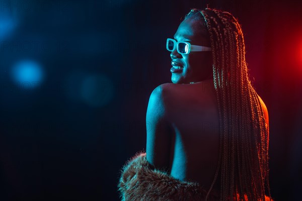 Black ethnic woman with braids with blue and red led lights