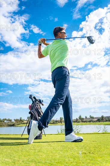 A player playing golf on the golf course