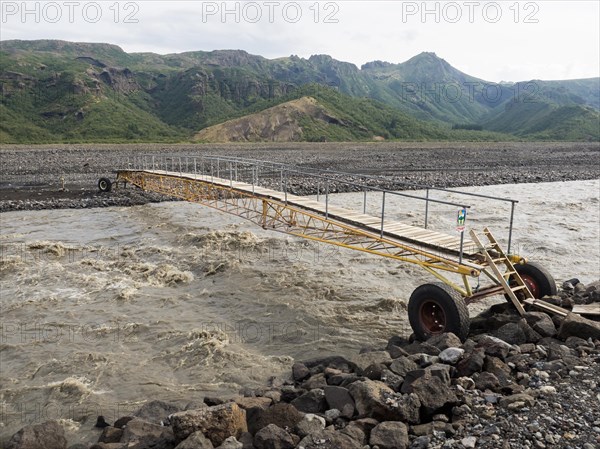 Mobile bridge over the glacial river Krossa