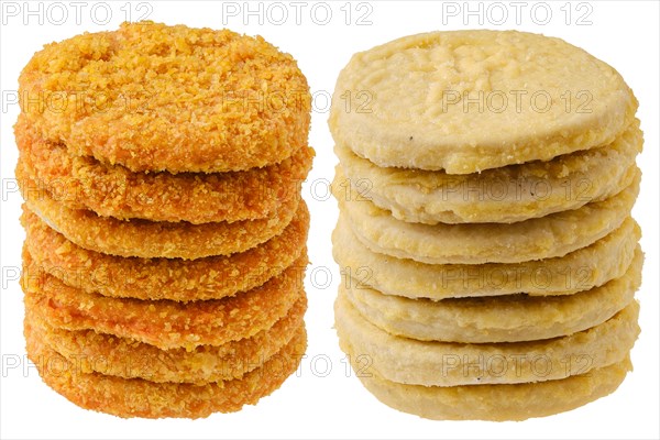 Stacks of semifinished frozen chicken and fish cutlets