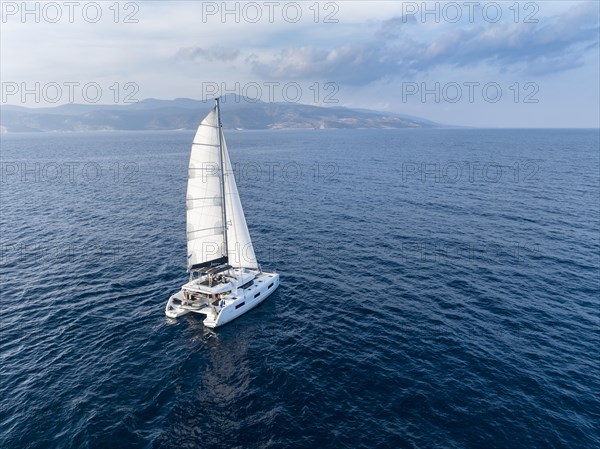 Sailing catamaran in full sail