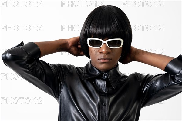 Black ethnic man in studio with white background