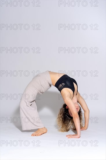 Young dancer in studio photo session with a white background