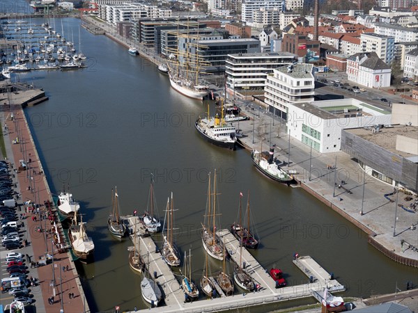View from the Sail City viewing platform of the New Harbour with sailing ships and modern buildings around the harbour