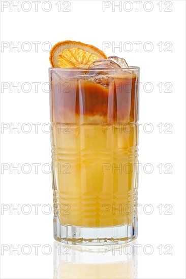 Citrus espresso and tonic cold drink in tall facetted glass with reflection