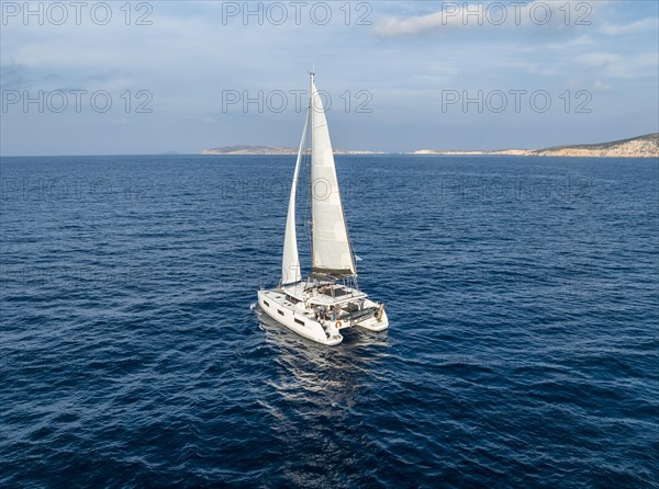 Sailing catamaran in full sail