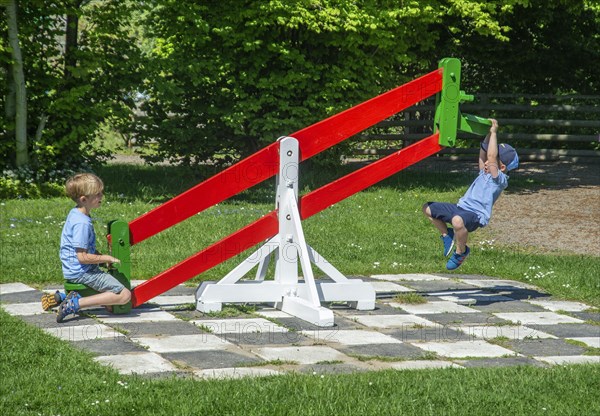 Play on seesaw on the old amusement park Braendesgardshaven or Joboland at Svaneke