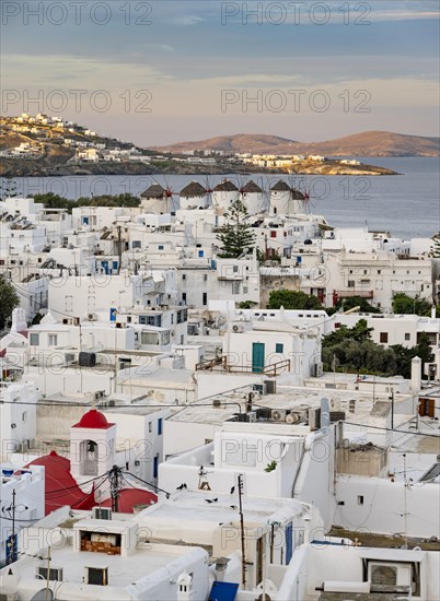 View over white Cycladic houses at sunrise