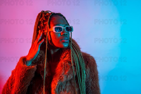 Black ethnic woman with braids with red and blue led lights