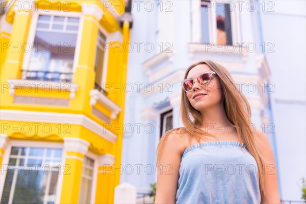 Portrait of attractive young woman in sunglasses