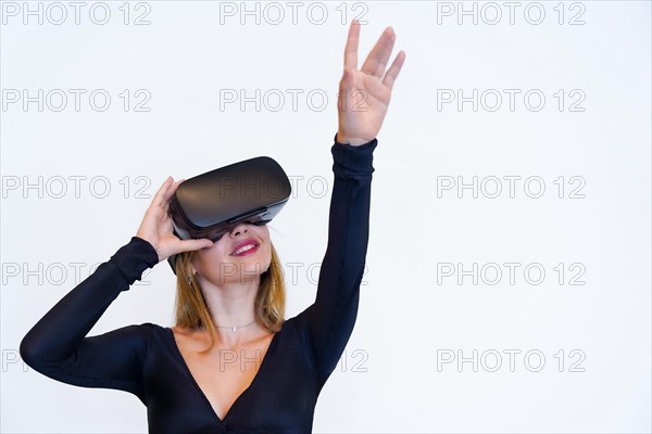 Woman with virtual reality glasses on white background