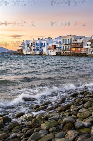 White Cycladic houses on the shore