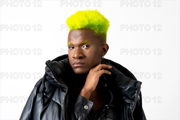 Black ethnic man in studio with white background