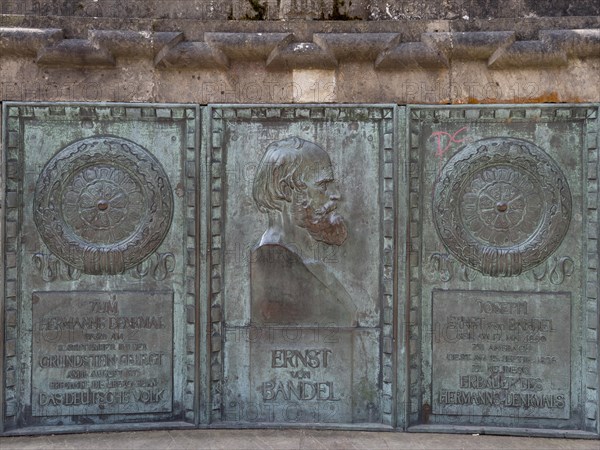 Bronze plaque in honour of the author of the colossal statue Hermann Monument Ernst von Bandel in front of the Hermann Monument