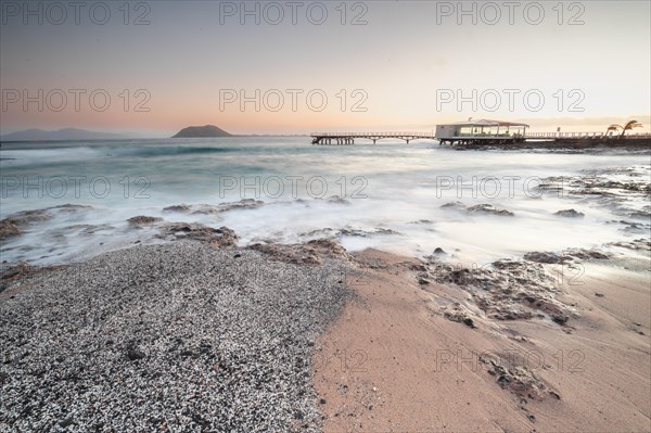 Long exposure at sunrise at the coast near Corralejo