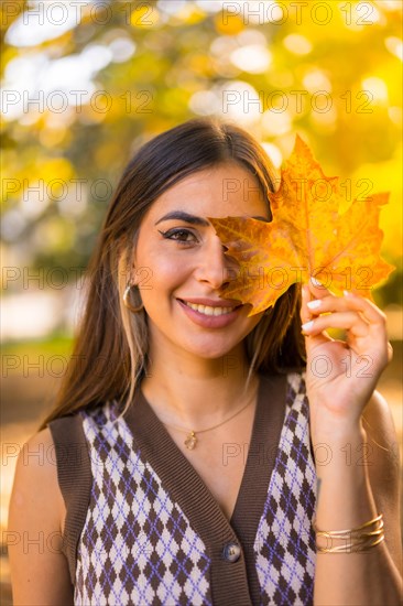 Portrait of a caucasian brunette woman in autumn
