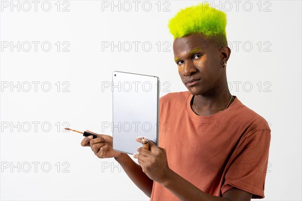 A gay black ethnic man putting on makeup