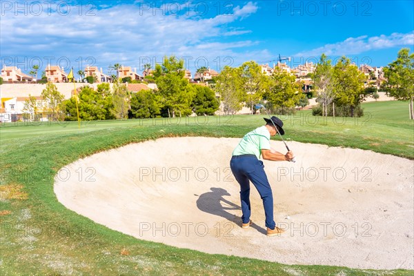 Man playing golf