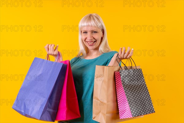 Smiling shopping with bags on sale