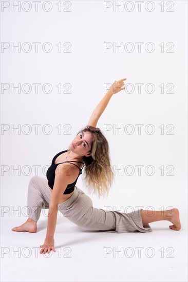 Young dancer in studio photo session with a white background