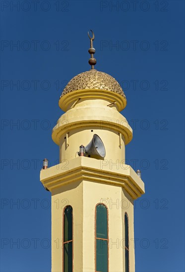 Yellow Minaret of Islamic Mosque with Loudspeaker