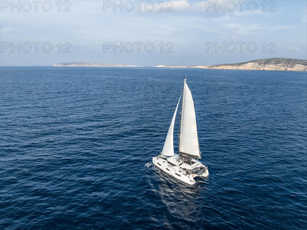 Sailing catamaran in full sail