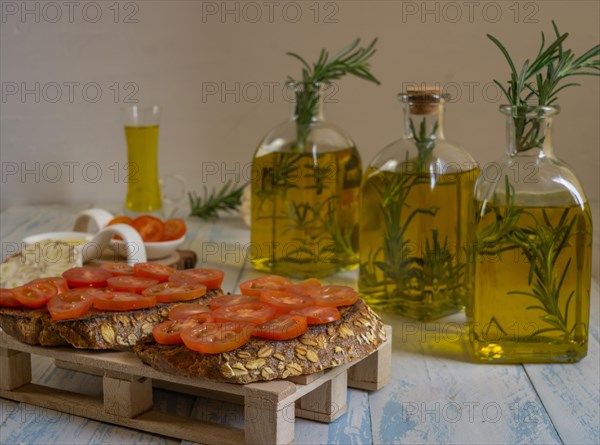 Toast bread with cherry tomato and olive oil with rosemary